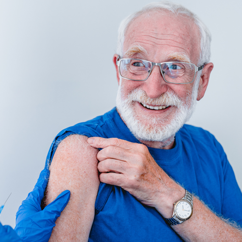 An older gentleman receiving a vaccine